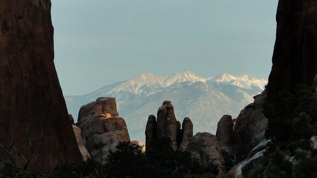 Composition rule 4: Framing. Photo of a mountain, framed by rocks.