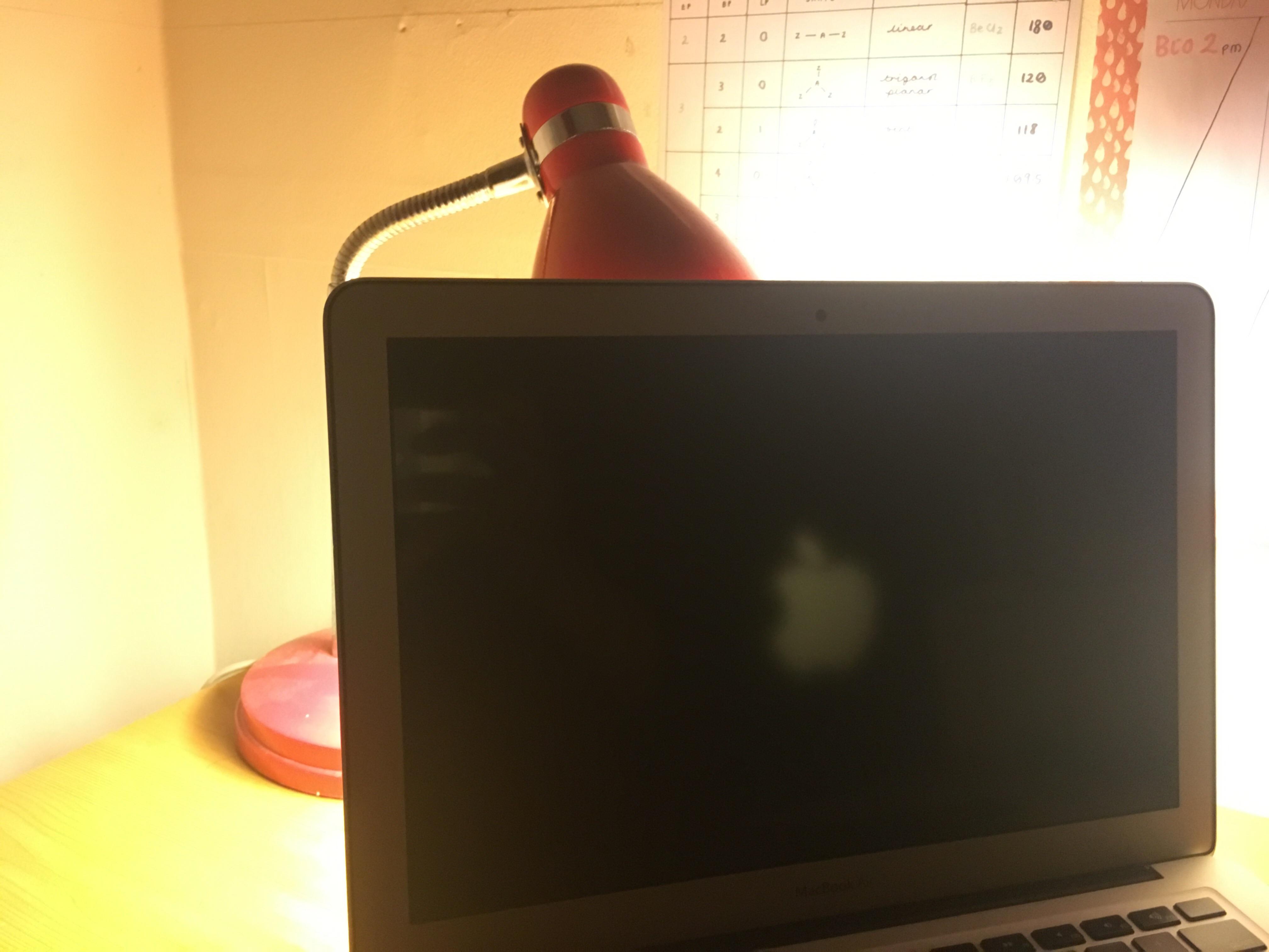 how to turn on macbook when screen is black